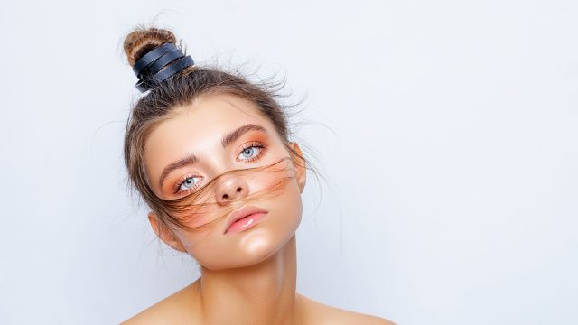 Fashion,Model,Posing,In,Studio,,Beautiful,Girl,Hair,Gathered,In