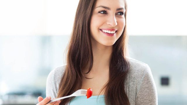 Woman eating salad