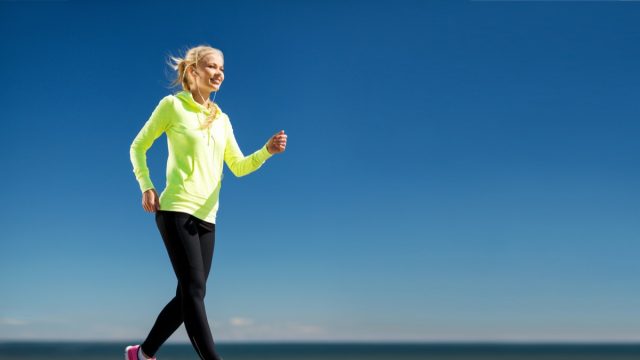 Woman walking outdoors.