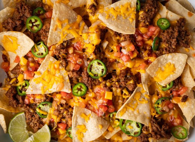 nachos in white iron pan
