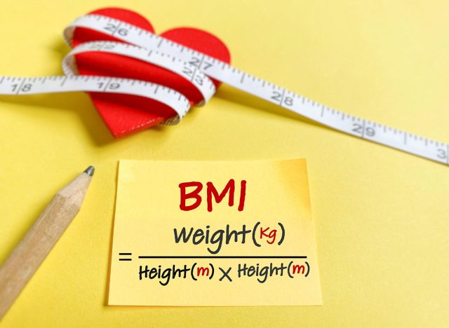 Body Mass Index, BMI formula written on adhesive notepaper background. Health care concept.