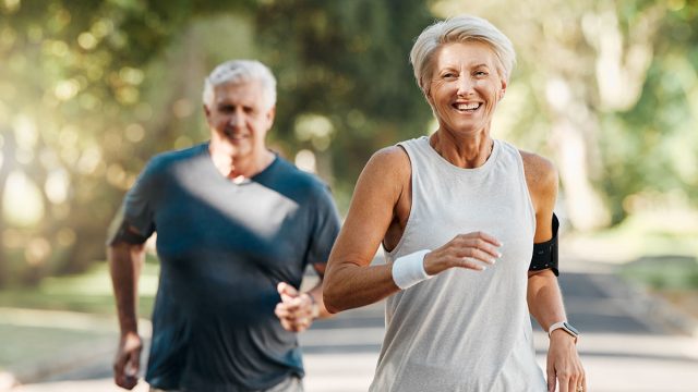 Retirement, couple and running fitness health for body and heart wellness with natural ageing. Married, mature and senior people enjoy nature run together for cardiovascular vitality workout.
