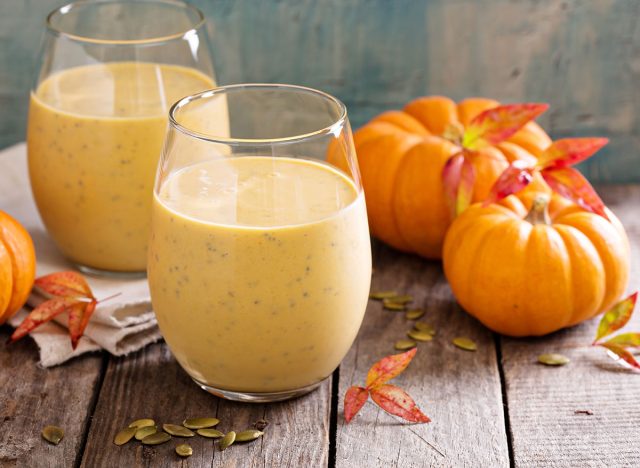 Healthy pumpkin smoothie with chia seed in glasses on rustic background