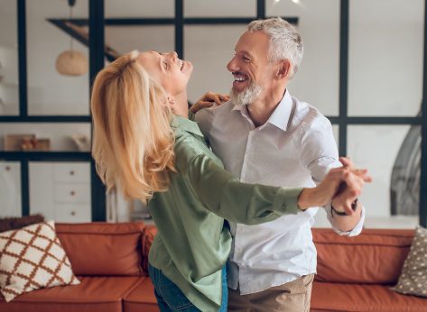 Dancing. Nice couple dancing in the room and looking happy