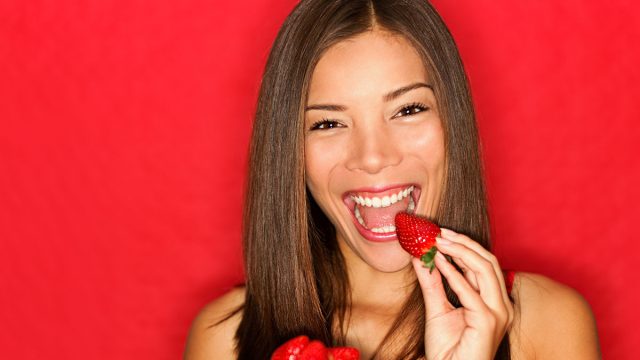 Woman,Eating,Strawberries,Happy.,Pretty,Girl,Eating,Healthy,Snack,On