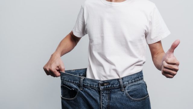 Young,Confident,Asian,Chinese,Weight,Loss,Man,With,Oversize,Of