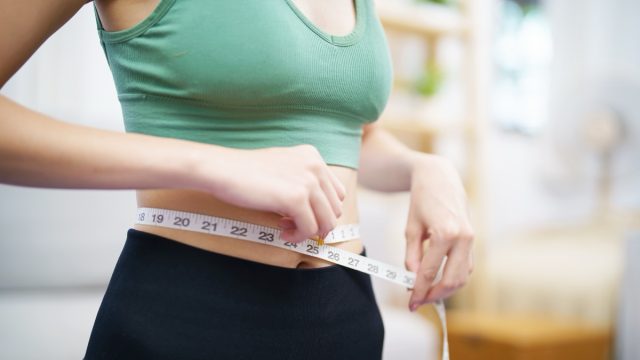 Asian,Healthy,Woman,Dieting,Weight,Loss.,Slim,Woman,Measuring,Waist