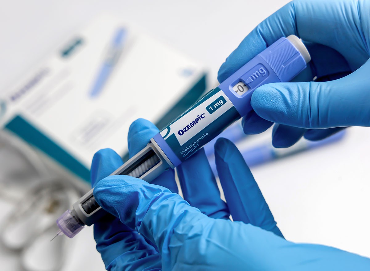 Hands,In,Blue,Surgical,Gloves,Holding,Ozempic,Insulin,Injection,Pen