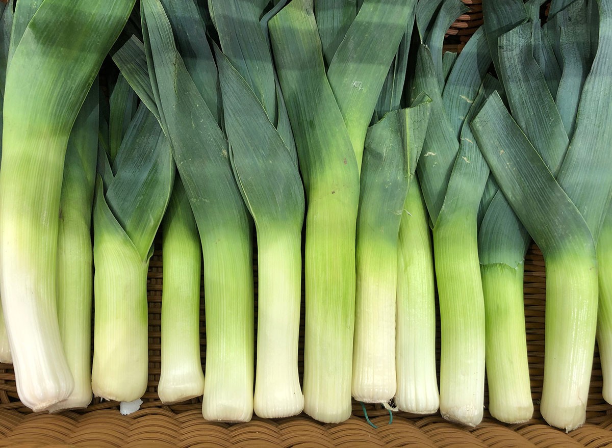Macro photo green onion leek. Stock photo lettuce vegetable background