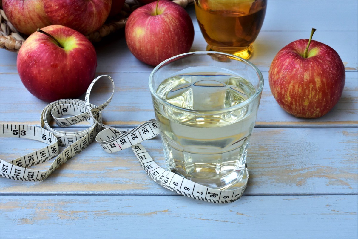 Apple,Cider,Vinegar,With,Water,,In,A,Glass,,Measuring,Tape,