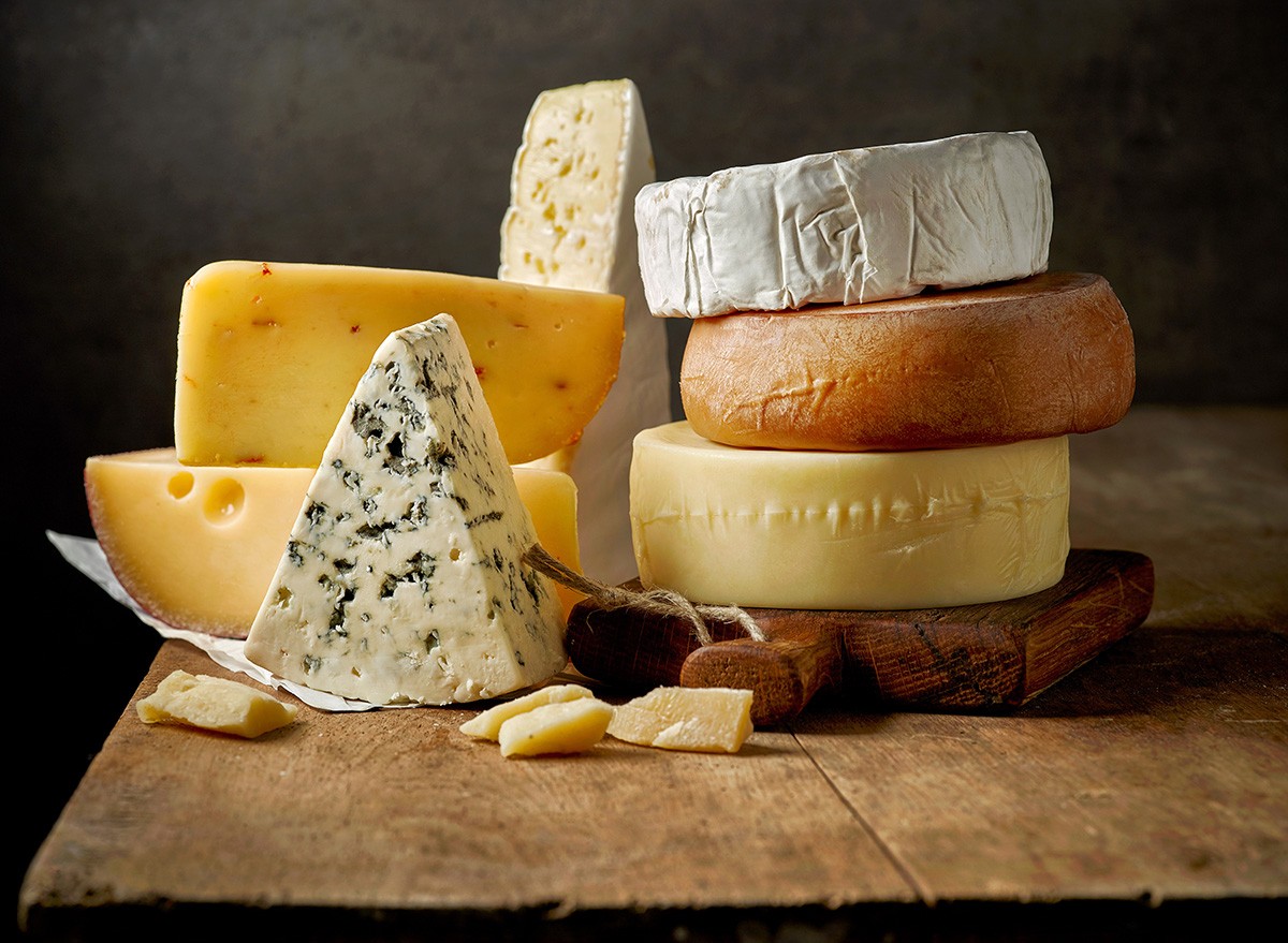 Various,Types,Of, Cheese ,On,Rustic,Wooden,Table, dairy
