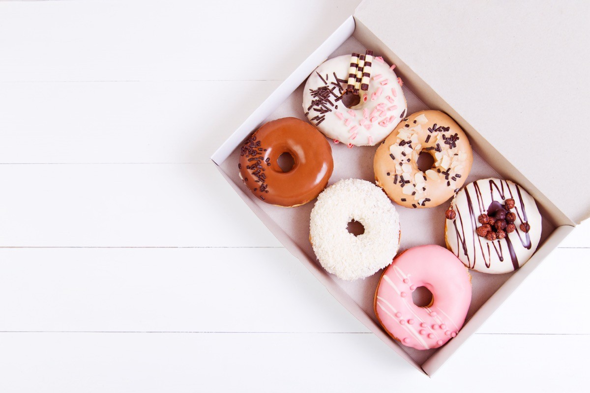 Colored,Delicious,Donuts,With,Sprinkles,In,A,Box,On,A