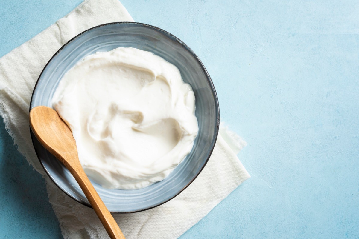 Homemade,Greek,Yogurt,In,Bowl,On,Blue,Background,,Top,View,