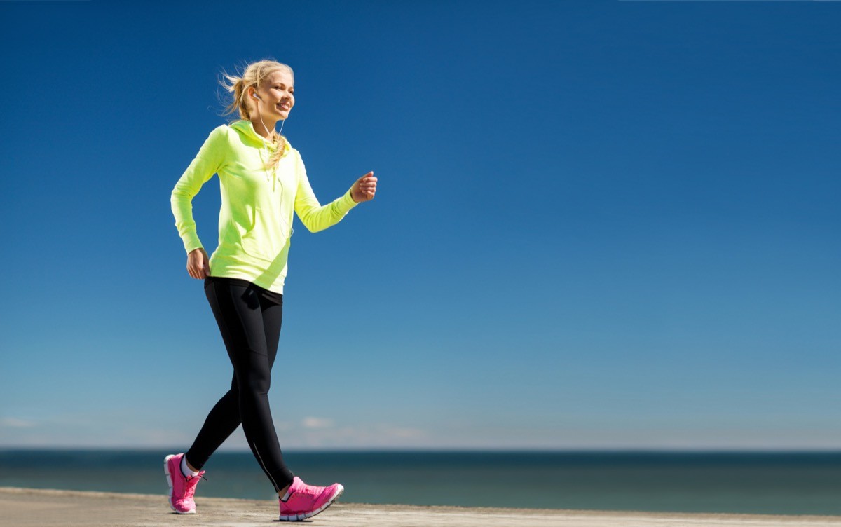 Woman walking outdoors.