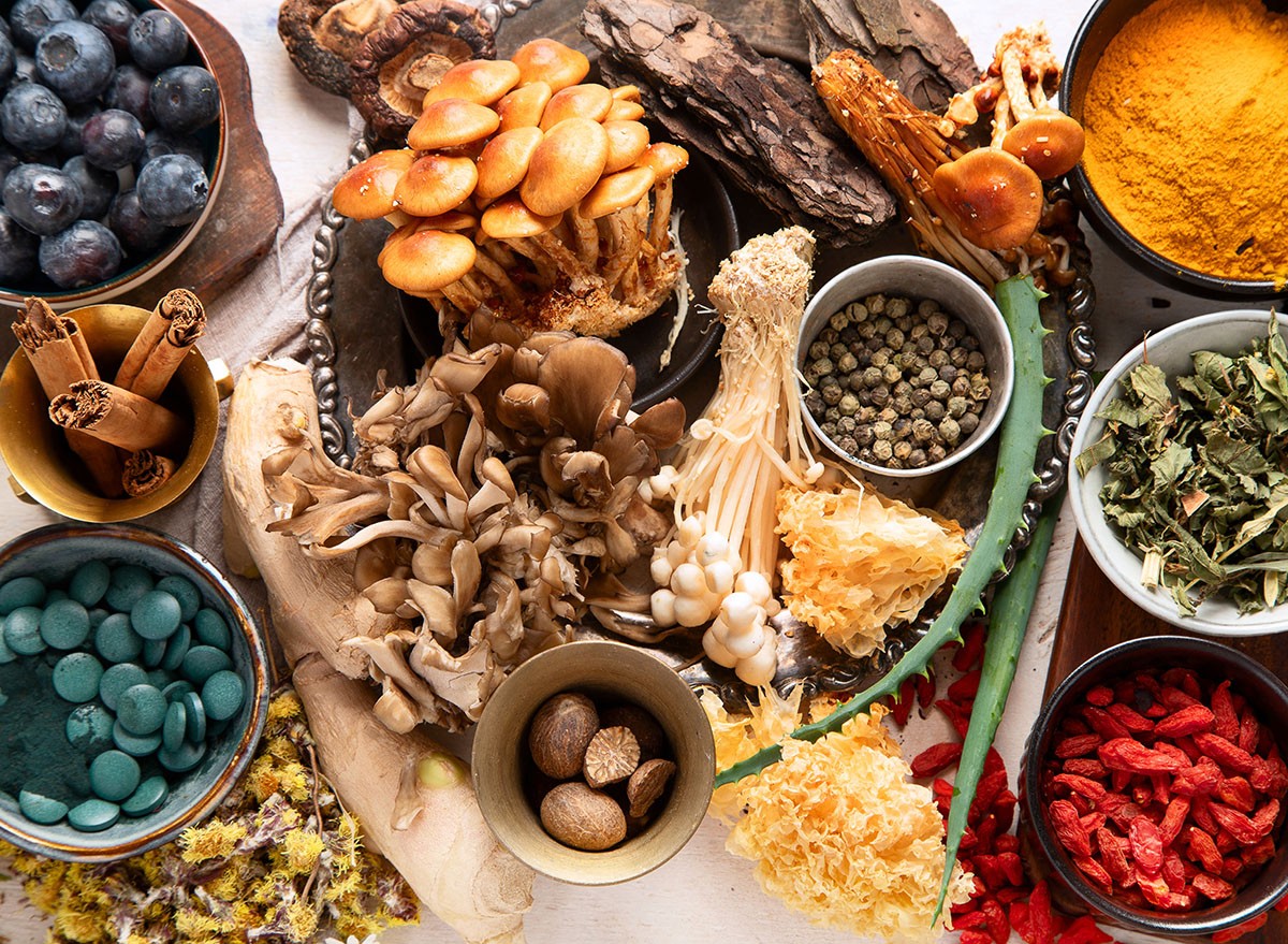 Healthy natural adaptogen. Herbs, spices, mushrooms on light background. Nervine food collection. Top view