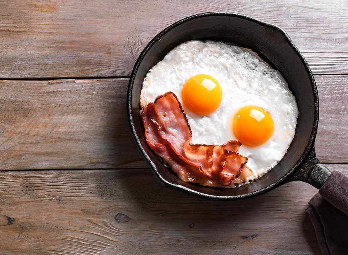 Fried,Eggs,And,Bacon,For,Breakfast,On,Wooden,Table,,Top
