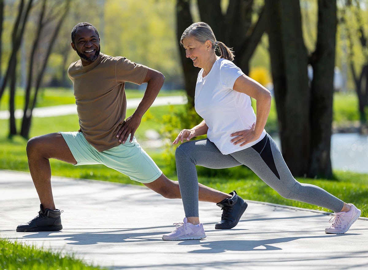 Mature couple having a workout together in the park