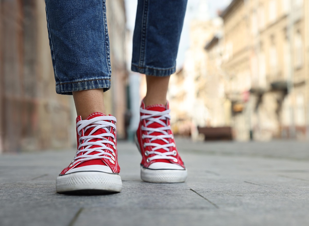 Woman,Sneakers,Walking,On,City,Street,exercise