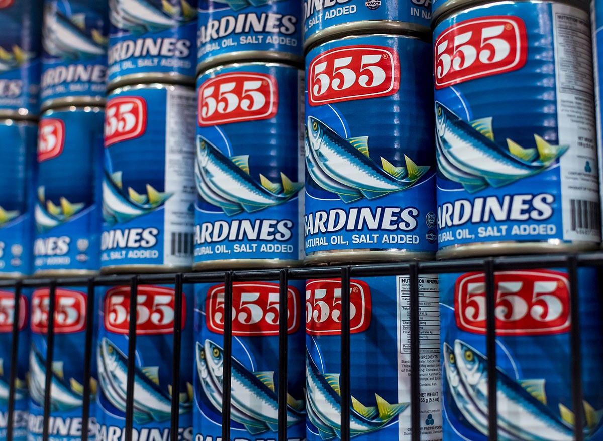 sardines canned in natural oil on display at a shelf at a supermarket.
