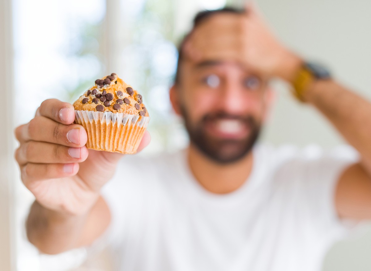Man,Eating,Chocolate,Chips,Muffin,sad,worried,diet,breakfast