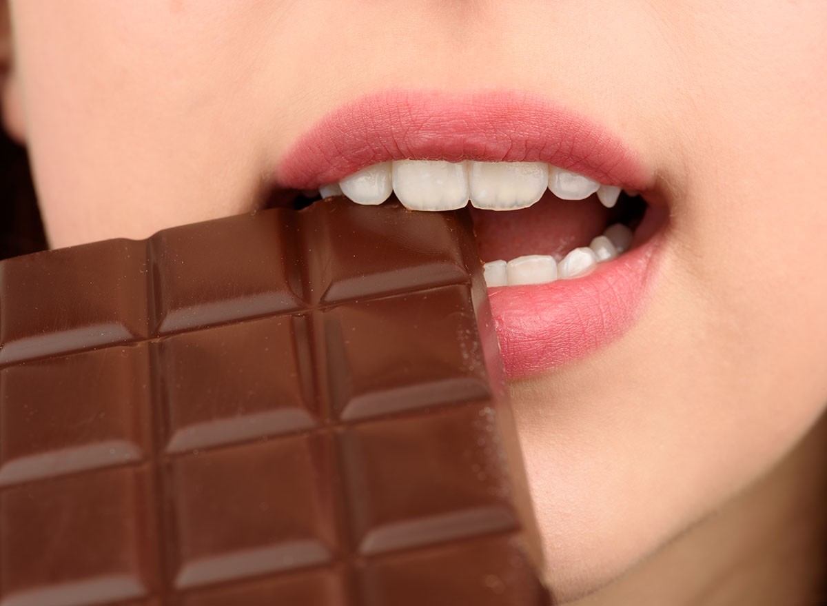 Closeup of woman eating chocolate
