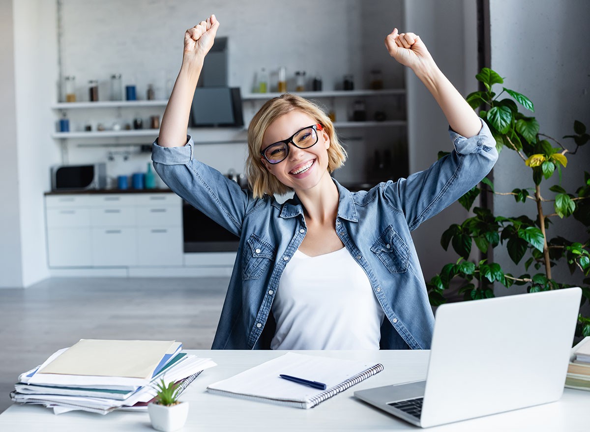 young blonde woman in eyeglasses happy with raised hands, happy, celebrate, celebration, office, fitness