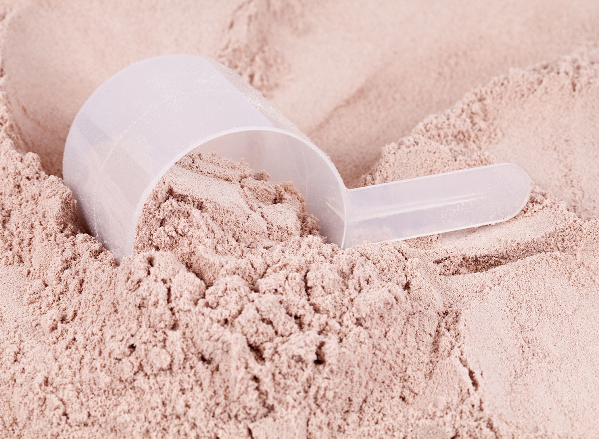 A scoop of chocolate whey isolate protein powder
