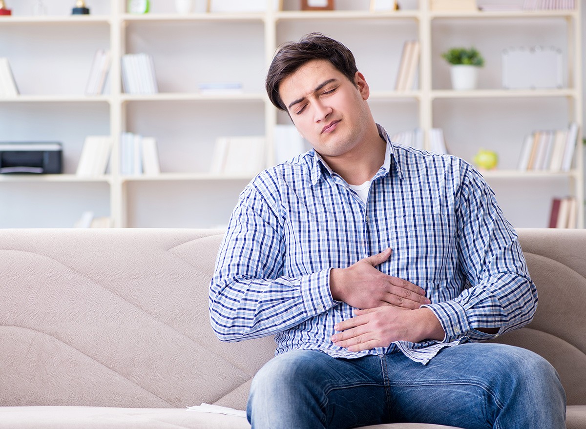 Sick,Man,Suffering,At,Home,From,Infection,And,Bad,Stomach,tummy,bloated, bloating, guts, overweight, obese