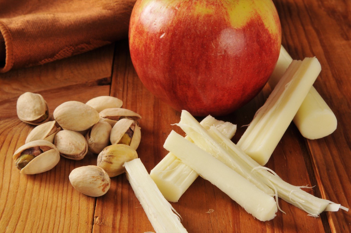 Pistachio nuts with an apple and string cheese