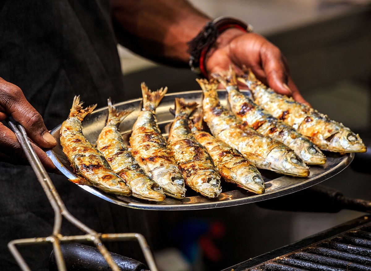 Freshly grilled sardines on a silver plate fish