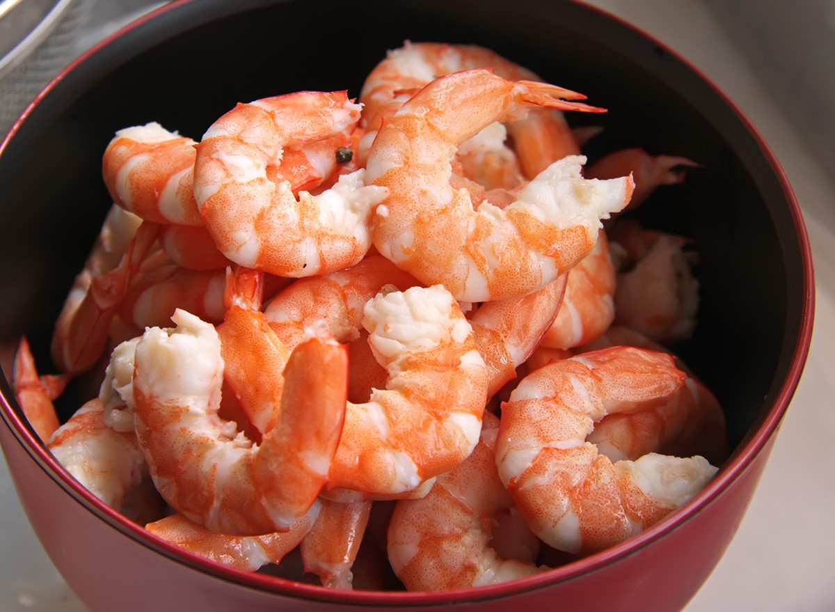 Whole fresh peeled cooked prawns in bowl