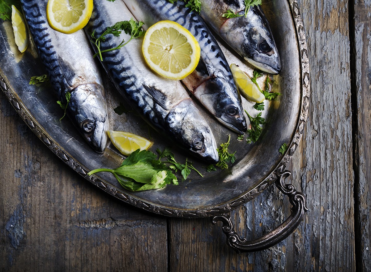 Mackerels served on silver plate with lemon, fish