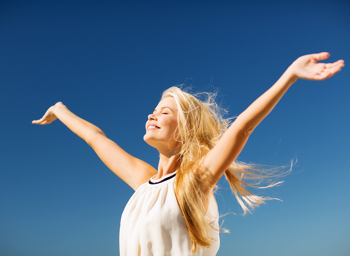 lifestyle concept - beautiful happy woman enjoying summer outdoors, success, celebrate