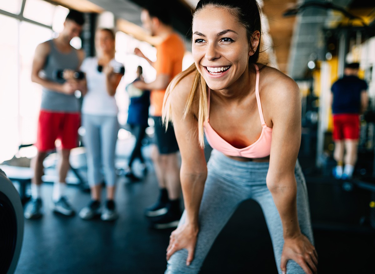 ,Fit,Woman,In,Gym,happy,exercise,workout,smile,fitness