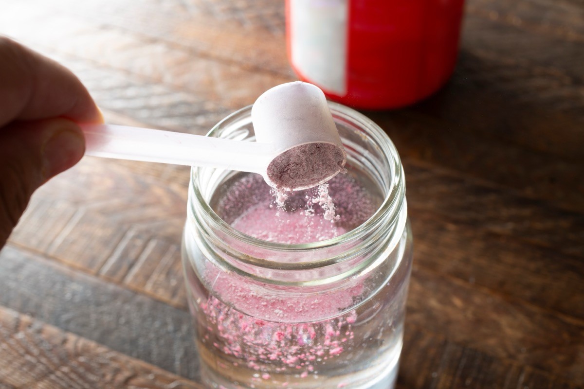 A,View,Of,A,Hand,Scooping,Electrolyte,Powder,Into,A