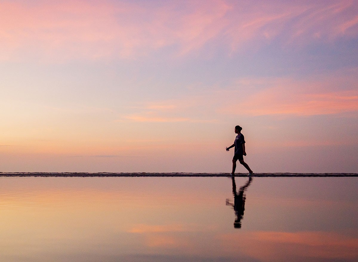 Underwater,Reflection,Silhouette,Of,A,Girl,Walking,On,The,Seashore